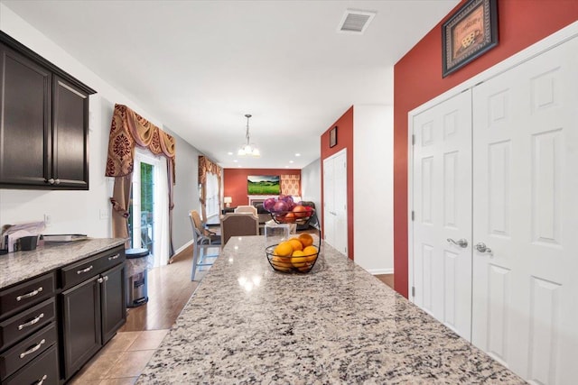 26 Kyleigh Way, Middletown, NY 10940 - kitchen with a chandelier, open floor plan, light stone counters, and hanging light fixtures