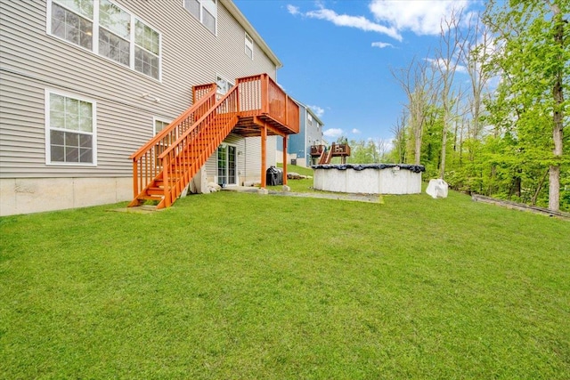 26 Kyleigh Way, Middletown, NY 10940 - back of property with stairway, a wooden deck, a lawn, and a covered pool