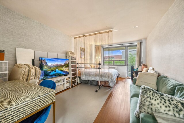bedroom featuring wood finished floors