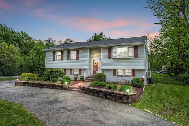 149 E Main St, Washingtonville, NY 10992 - bi-level home with central AC unit and asphalt driveway