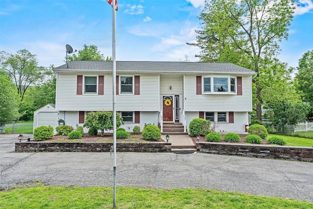 149 E Main St, Washingtonville, NY 10992 - split foyer home with an outdoor structure and stucco siding