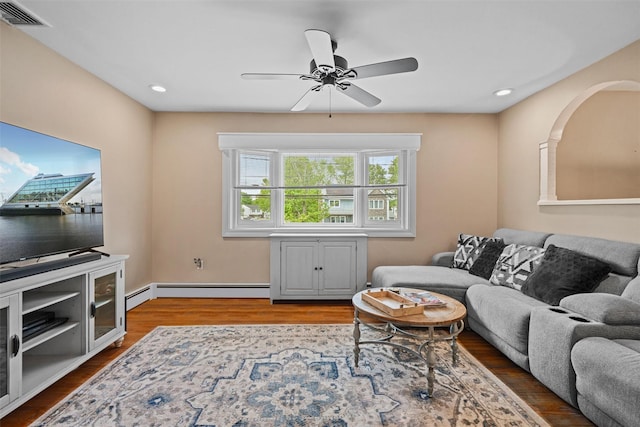 149 E Main St, Washingtonville, NY 10992 - living area with ceiling fan, wood finished floors, a baseboard radiator, and recessed lighting
