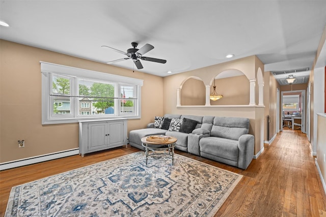 149 E Main St, Washingtonville, NY 10992 - living room with ceiling fan, wood finished floors, a baseboard radiator, recessed lighting, and baseboards