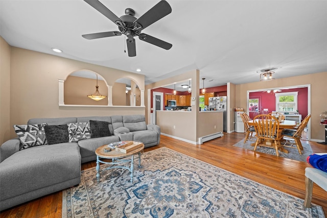 149 E Main St, Washingtonville, NY 10992 - living area featuring ceiling fan, wood finished floors, a baseboard radiator, baseboards, and recessed lighting
