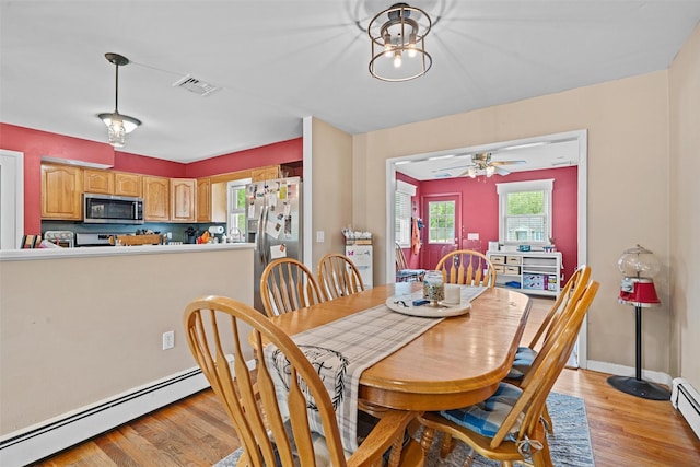 149 E Main St, Washingtonville, NY 10992 - dining space with a baseboard radiator, light wood-type flooring, ceiling fan, and baseboards