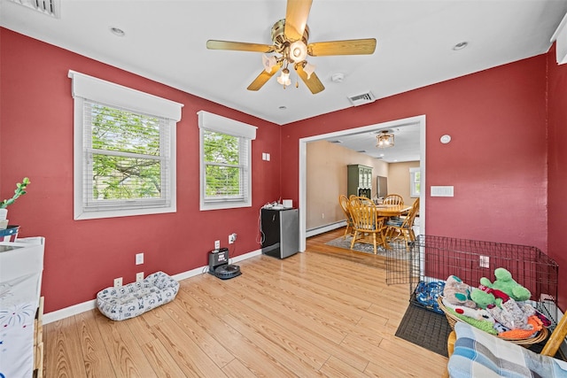 149 E Main St, Washingtonville, NY 10992 - dining room with a ceiling fan, wood finished floors, a baseboard heating unit, baseboards, and recessed lighting
