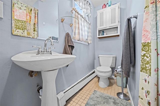 149 E Main St, Washingtonville, NY 10992 - full bath featuring toilet, baseboard heating, tile patterned floors, and baseboards