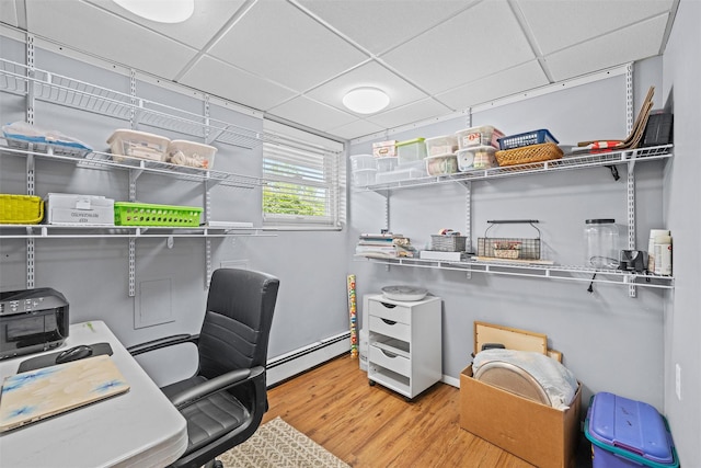 149 E Main St, Washingtonville, NY 10992 - office space featuring a baseboard heating unit, a drop ceiling, and wood finished floors