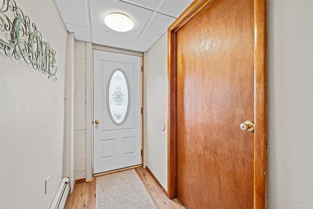 149 E Main St, Washingtonville, NY 10992 - doorway featuring a drop ceiling, light wood-style flooring, baseboards, and baseboard heating