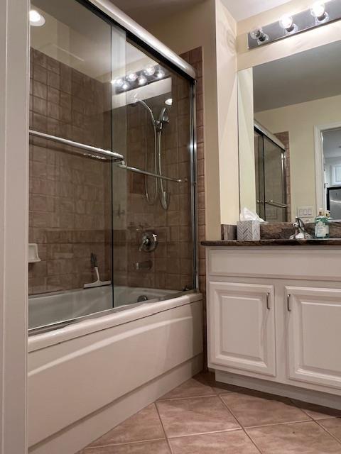 1105 Round Pointe Dr, Haverstraw, NY 10927 - bathroom with bath / shower combo with glass door, vanity, and tile patterned floors