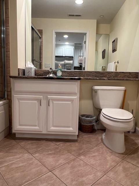 1105 Round Pointe Dr, Haverstraw, NY 10927 - bathroom with a shower with shower door, toilet, and tile patterned floors