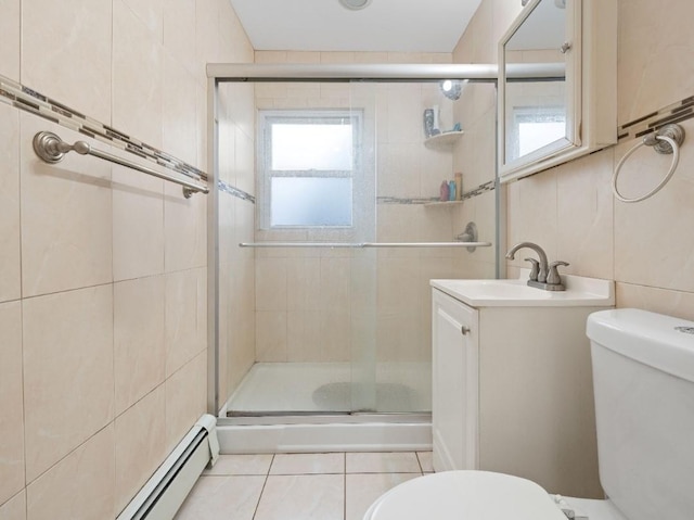 33 Saddle Ln, Levittown, NY 11756 - full bathroom featuring tile walls, toilet, a stall shower, vanity, and tile patterned floors