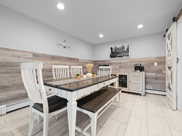 33 Saddle Ln, Levittown, NY 11756 - dining area featuring a barn door, recessed lighting, and beverage cooler