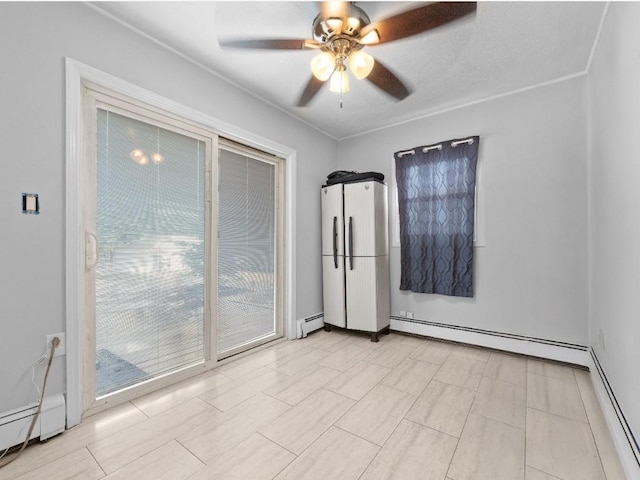 33 Saddle Ln, Levittown, NY 11756 - spare room featuring baseboard heating, ceiling fan, and baseboards