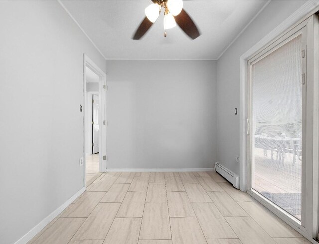 33 Saddle Ln, Levittown, NY 11756 - empty room with baseboard heating, a ceiling fan, ornamental molding, and baseboards