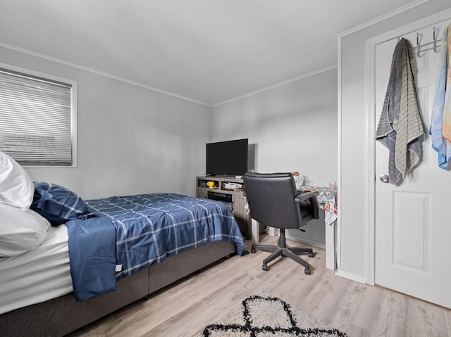 33 Saddle Ln, Levittown, NY 11756 - bedroom featuring light wood-style flooring and ornamental molding