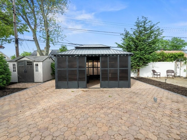 33 Saddle Ln, Levittown, NY 11756 - view of shed with a gazebo and fence