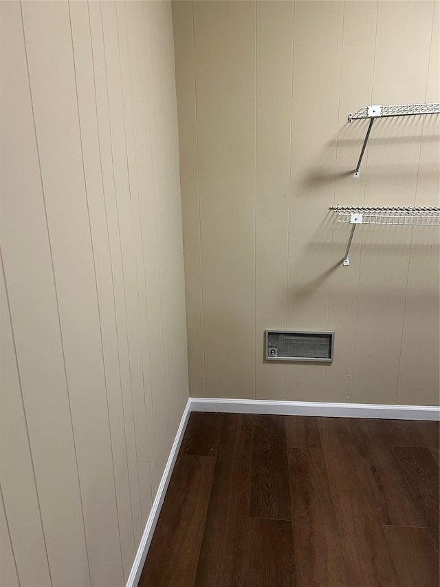 spare room with wood finished floors and baseboards