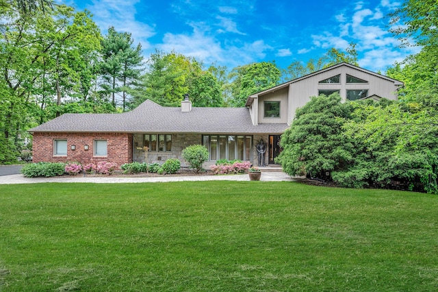 2 Farmview Dr, Dix Hills, NY 11746 - mid-century home featuring a front yard, a chimney, and stone siding