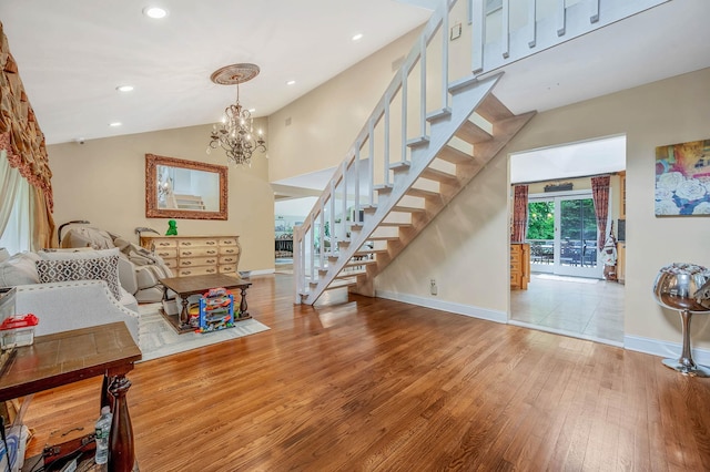 2 Farmview Dr, Dix Hills, NY 11746 - entryway with wood finished floors, stairs, baseboards, a chandelier, and lofted ceiling