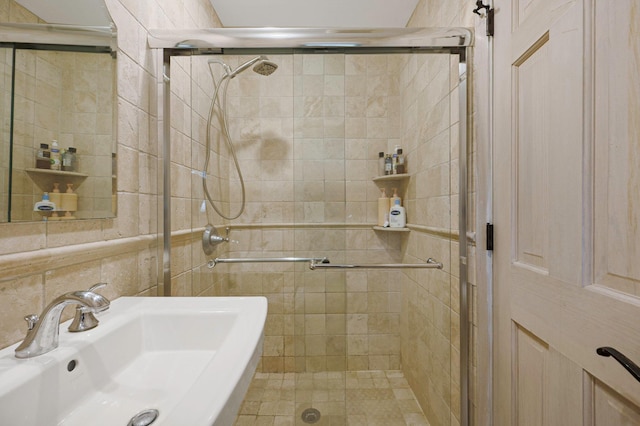2 Farmview Dr, Dix Hills, NY 11746 - bathroom featuring a sink, a stall shower, and tile walls