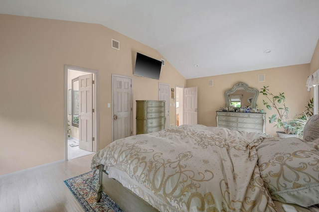 2 Farmview Dr, Dix Hills, NY 11746 - bedroom featuring vaulted ceiling, wood finished floors, and baseboards
