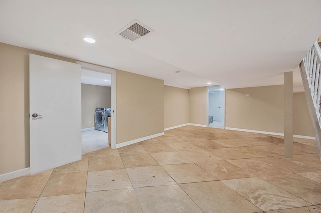 2 Farmview Dr, Dix Hills, NY 11746 - finished below grade area with washing machine and clothes dryer, recessed lighting, baseboards, and light tile patterned floors