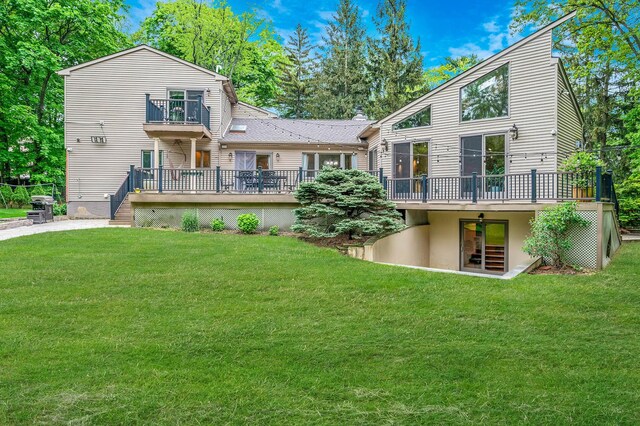 2 Farmview Dr, Dix Hills, NY 11746 - back of house with a wooden deck, a yard, and a balcony