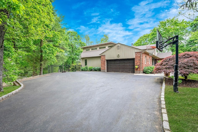 2 Farmview Dr, Dix Hills, NY 11746 - mid-century home with asphalt driveway, brick siding, and a garage