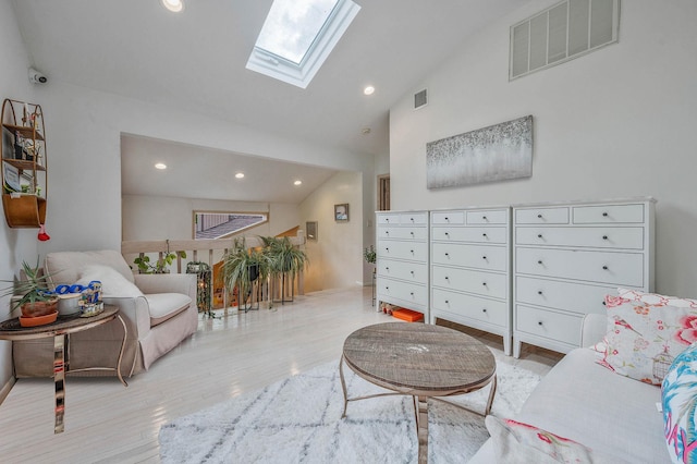 2 Farmview Dr, Dix Hills, NY 11746 - living area featuring a skylight, wood finished floors, recessed lighting, and high vaulted ceiling