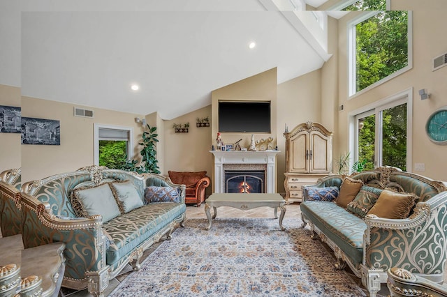 2 Farmview Dr, Dix Hills, NY 11746 - living area featuring a warm lit fireplace, high vaulted ceiling, and recessed lighting