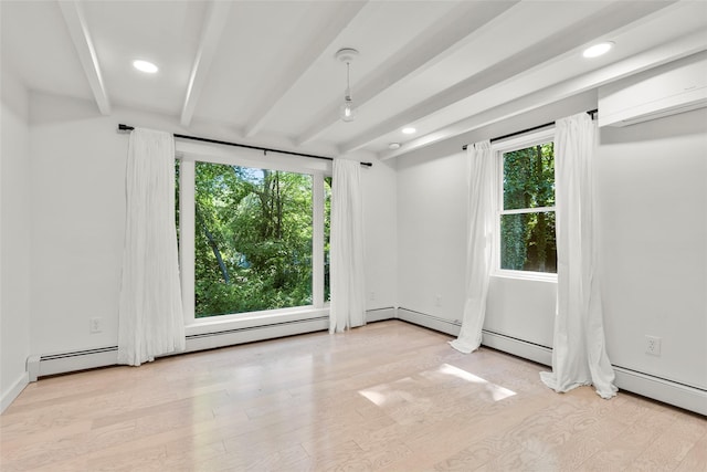 51/2 Locust Ave, Stony Brook, NY 11790 - unfurnished room featuring beam ceiling, healthy amount of natural light, an AC wall unit, wood finished floors, and recessed lighting