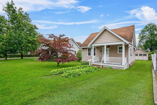 16 Oak Ter, Suffern, NY 10901 - view of front of property with covered porch, a front lawn, roof with shingles, and a garage