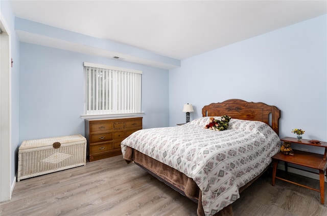 bedroom featuring wood finished floors