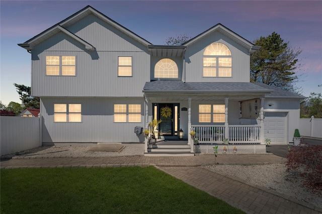 178 Prospect Pl, Bay Shore, NY 11706 - view of front facade featuring a porch, fence, a garage, and a shingled roof