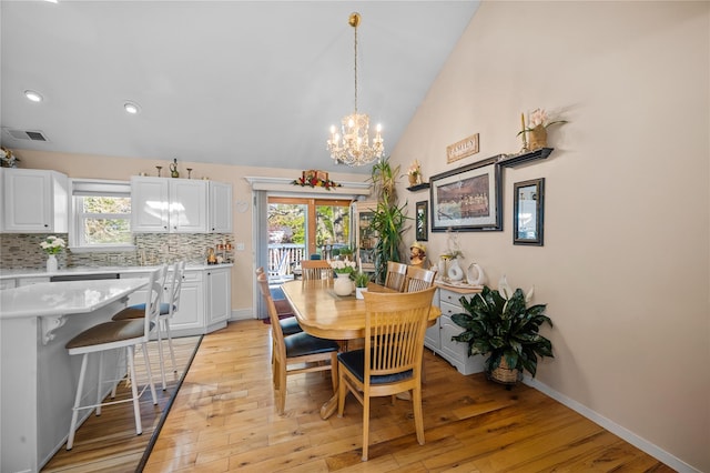 178 Prospect Pl, Bay Shore, NY 11706 - dining area featuring a chandelier, light wood-type flooring, lofted ceiling, recessed lighting, and baseboards