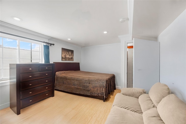 178 Prospect Pl, Bay Shore, NY 11706 - bedroom with ornamental molding, light wood-style floors, recessed lighting, and baseboards