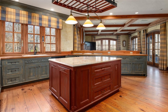 118 John St, Greenwich, CT 06831 - kitchen featuring a sink, french doors, a kitchen island, light wood-style floors, and coffered ceiling