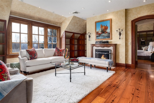 118 John St, Greenwich, CT 06831 - living room featuring wood-type flooring, recessed lighting, baseboards, and a high end fireplace
