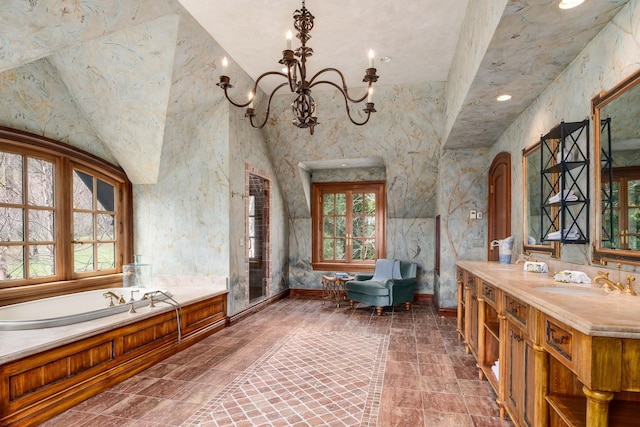 118 John St, Greenwich, CT 06831 - bathroom with a freestanding bath, a chandelier, a high ceiling, vanity, and recessed lighting