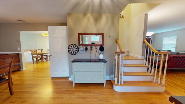 10 Courtney Ln, Brewster, NY 10509 - staircase featuring wood finished floors, a baseboard radiator, and baseboards
