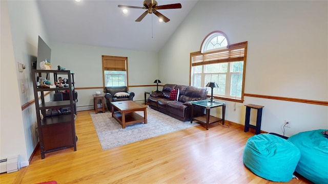 10 Courtney Ln, Brewster, NY 10509 - living room featuring a ceiling fan, high vaulted ceiling, wood finished floors, and a baseboard heating unit