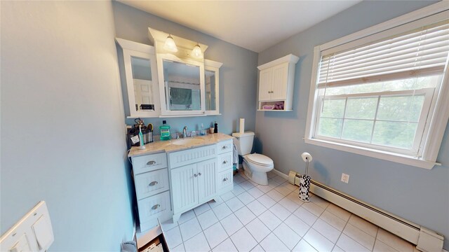 10 Courtney Ln, Brewster, NY 10509 - bathroom featuring baseboard heating, toilet, tile patterned floors, vanity, and baseboards