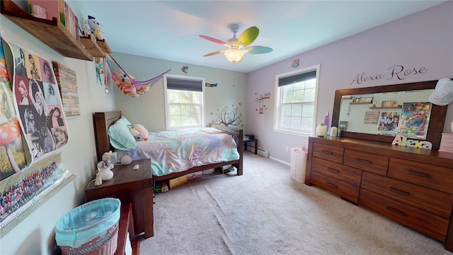 10 Courtney Ln, Brewster, NY 10509 - bedroom with light carpet, a baseboard heating unit, ceiling fan, and baseboards