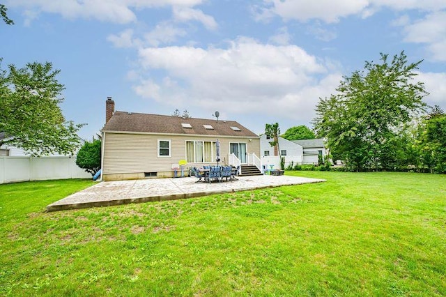 rear view of property with a patio area, a chimney, and entry steps