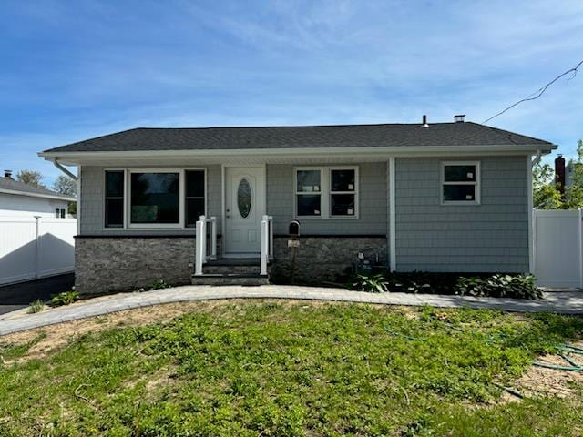 14 Chenango Dr, Bay Shore, NY 11706 - view of front facade featuring stone siding