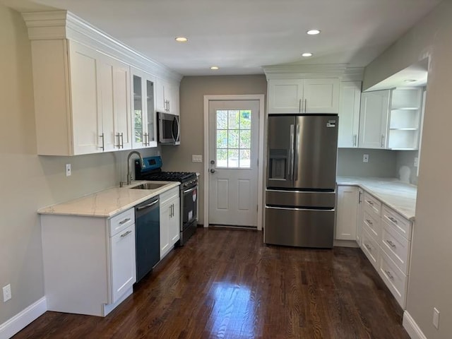 14 Chenango Dr, Bay Shore, NY 11706 - kitchen featuring appliances with stainless steel finishes, white cabinetry, dark wood finished floors, a sink, and open shelves