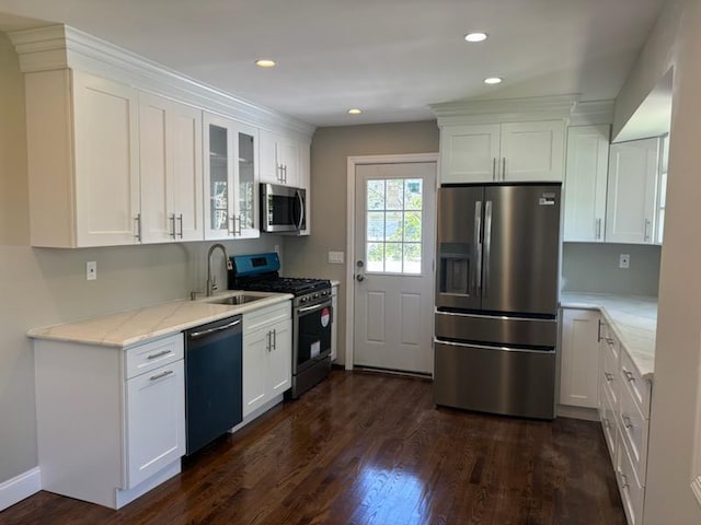 14 Chenango Dr, Bay Shore, NY 11706 - kitchen featuring appliances with stainless steel finishes, a sink, white cabinets, light stone counters, and dark wood-style floors