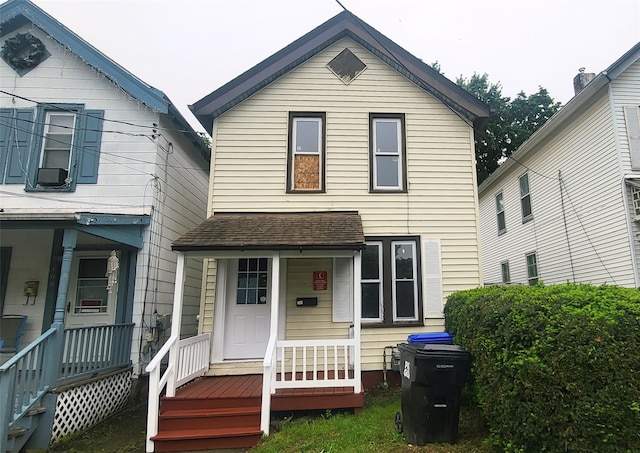 164 Thompson St, Poughkeepsie, NY 12601 - view of front facade with covered porch and a shingled roof