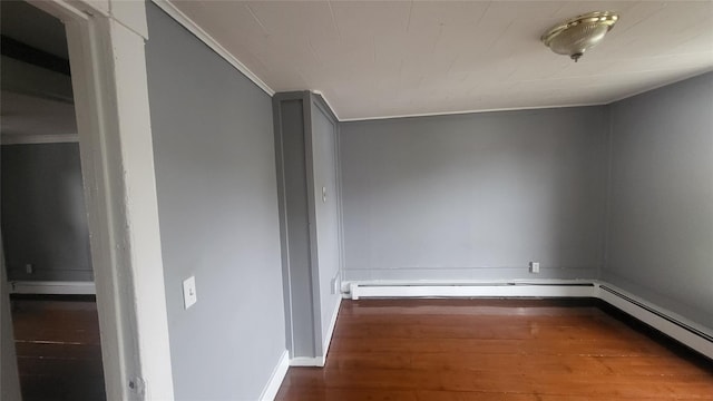 164 Thompson St, Poughkeepsie, NY 12601 - spare room featuring wood finished floors, ornamental molding, baseboards, and a baseboard heating unit
